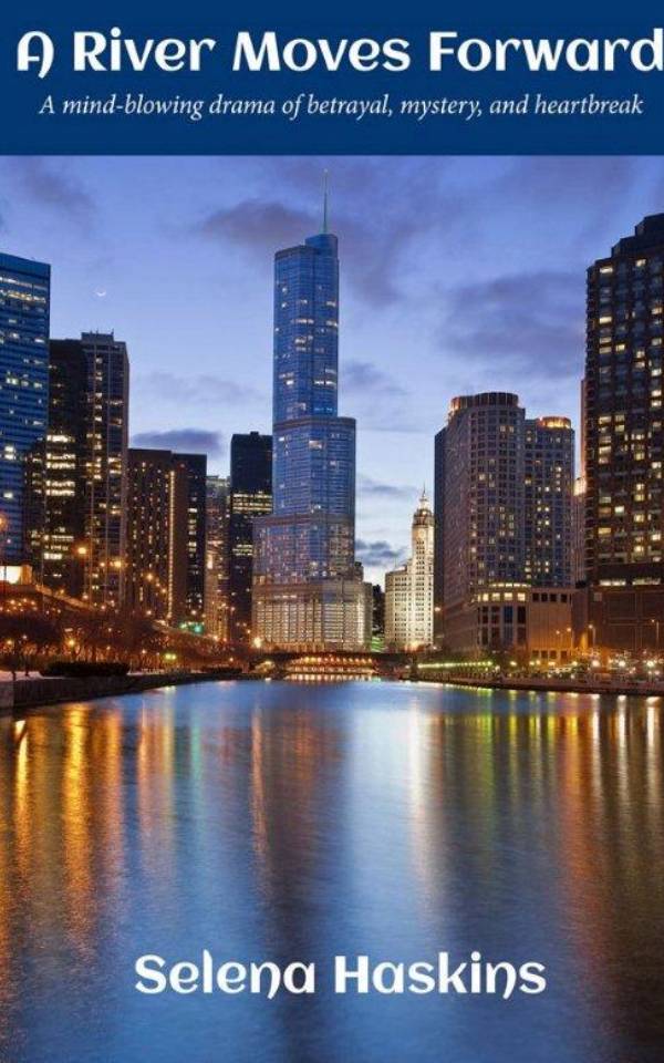 A city skyline with buildings and water at night.